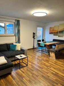 a living room with a couch and a table at Ferienwohnung Thöny in Vandans