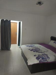 a bedroom with a bed and a door to a hallway at Studio Relax2 in Bacău