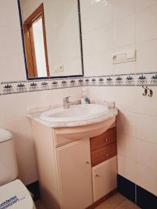 a bathroom with a sink and a mirror at Altos del Mar in Santa Pola +51 photos