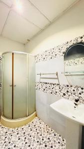 a bathroom with a shower and a sink at Ayomal Beach Paradise in Galle +25 photos