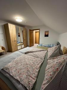 a bedroom with two beds with pillows on it at FeWo HansUndChrista in Mariapfarr