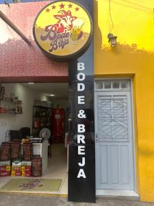 a store with a sign on the side of a building at Residência Central Triunfo-PE in Triunfo
