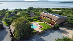 an aerial view of a house with a swimming pool at Vakasha Lodge in Siphofaneni