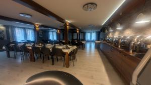 a dining room with tables and chairs in a restaurant at FitnessFun in Krzyż