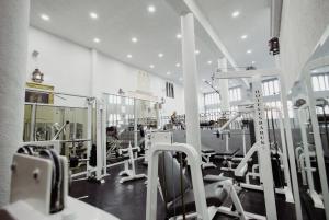 a large room with a gym with cardio equipment at Hotel & Spa Hacienda Baruk in Zacatecas