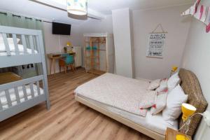 a bedroom with a bed and a bunk bed at Camping Hôtel Maui in Tournon-sur-Rhône +25 photos