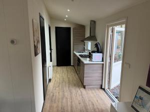 a kitchen with a sink and a counter top at First houses 82 in Rijen