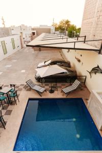 a swimming pool on top of a building with a car at Costa Apartments in La Paz