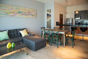 a living room with a couch and a table at Costa Apartments in La Paz