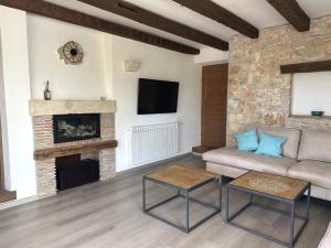 a living room with a couch and a fireplace at Villa Doba - Visnjan in Višnjan