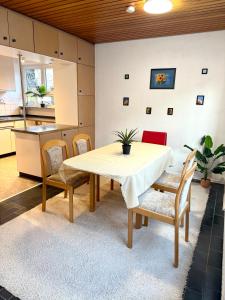 a kitchen and dining room with a table and chairs at Haus Elisabeth in Nagold