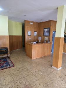 a lobby with a reception desk in a building at Hotel Espada a 174 kilómetros de Santiago de Compostela in A Rúa