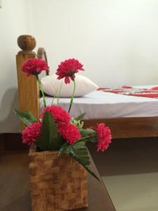 A bed or beds in a room at Sun Rest Mirissa