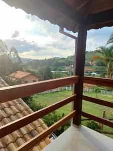 a view from the balcony of a house at Chalés Maktub 1 in Camanducaia