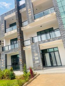 an image of an apartment building with balconies at Kigali Clever Homes Villa in Kigali