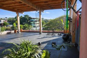 a gym with a view of a building at Casa Toro La Punta in Puerto Escondido