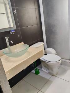a bathroom with a sink and a toilet at Casa pame 2026 in Mérida