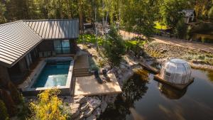 an overhead view of a house with a swimming pool at Sherlock Home in Czarnówiec