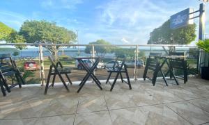 a group of tables and chairs on a patio at Hotel Xingu in Altamira