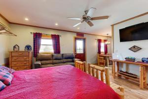 a bedroom with a bed and a living room at Pet Friendly! Couples Retreat in Southern Illinois in Etherton
