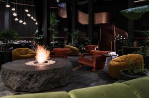 a lobby with a fire pit in the middle at Volga, Member of Preferred Hotels & Resorts in Mexico City