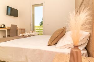 a bedroom with a bed with feathers on it at B&B Conero Hermitage in Marcelli +15 photos