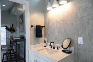 a bathroom with a sink and a shower at North Shore Palms in Mokuleia