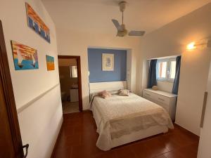 a small bedroom with a bed and a window at Maison Raphael Positano in Positano