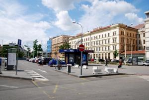 a city street with a stop sign and buildings at Relax apartmá Brno central - Brno střed in Brno