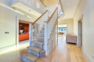 a staircase in a home with wooden floors at Wayside Farm in Staveley +55 photos