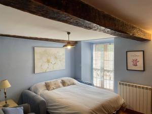 a bedroom with a bed and a window at Las Carminas in Soto