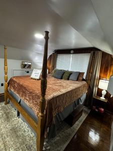 a bedroom with a large bed in a room at Meadowview Guest House in Hillsboro