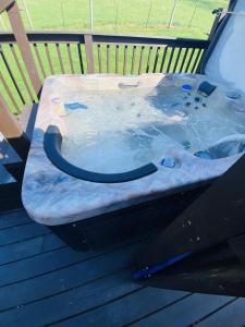 a hot tub sitting on the back of a car at Meadowview Guest House in Hillsboro