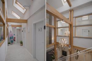 a hallway in a house with skylights at Hamburg Sleep Club in Hamburg
