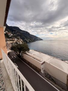 a view of the ocean from a balcony of a building at Maison Raphael Positano in Positano