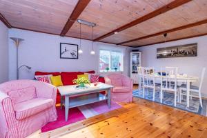 a living room with a couch and chairs and a table at KRO863-Virestad-Stubbalycke-4 in Virestad