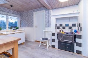 a kitchen with a stove and a counter top at KRO863-Virestad-Stubbalycke-4 in Virestad +12 photos