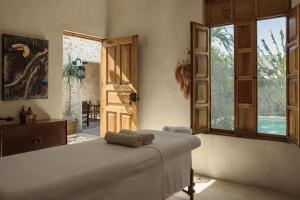 a bedroom with a bed and an open door at Campeche Mágico in Campeche +66 photos