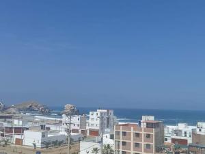 a view of a city with buildings and the ocean at Ocean Glips II in Punta Negra