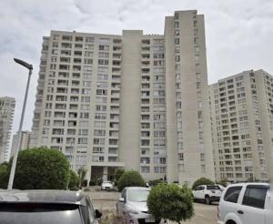 a large building with cars parked in front of it at Arena Marina-Sol l in El Cerrillo +4 photos