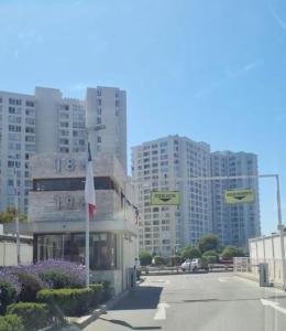 a parking lot with tall buildings in the background at Arena Marina-Sol l in El Cerrillo