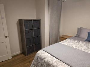 a bedroom with a bed and a dresser at Modern Victorian by Beach and Forest Unit D in Crescent City