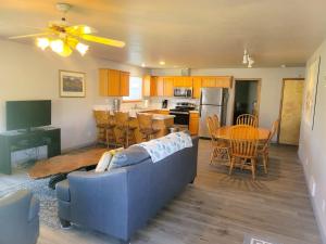 a living room with a blue couch and a table at The Hofer Beach Retreat in Crescent City