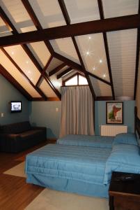 Un pat sau paturi într-o cameră la Pousada Castello Benvenutti