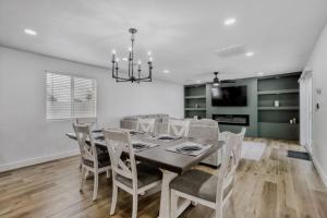 a dining room with a table and chairs at 4BR Mesa Basecamp, Mins to Cubs Spring Training in Mesa