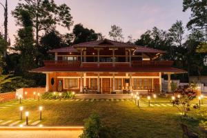 a house with lights in front of it at 1st Miracle By Mirth, Mythadi , Coorg in Ammatti