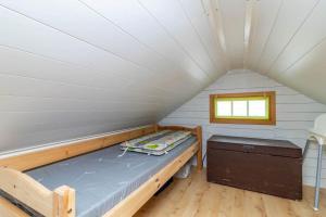 a small room with a bed and a window at VAR986-Rada-As-34 in Råda