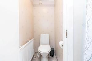 a bathroom with a white toilet in a room at VAR986-Rada-As-34 in Råda +14 photos