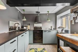 a large kitchen with white cabinets and a sink at AE315-Marstal-Kongensgade-8 in Marstal