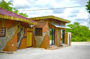 a building with a painting on the side of it at Makgadikgadi Riverview Inn in Nata